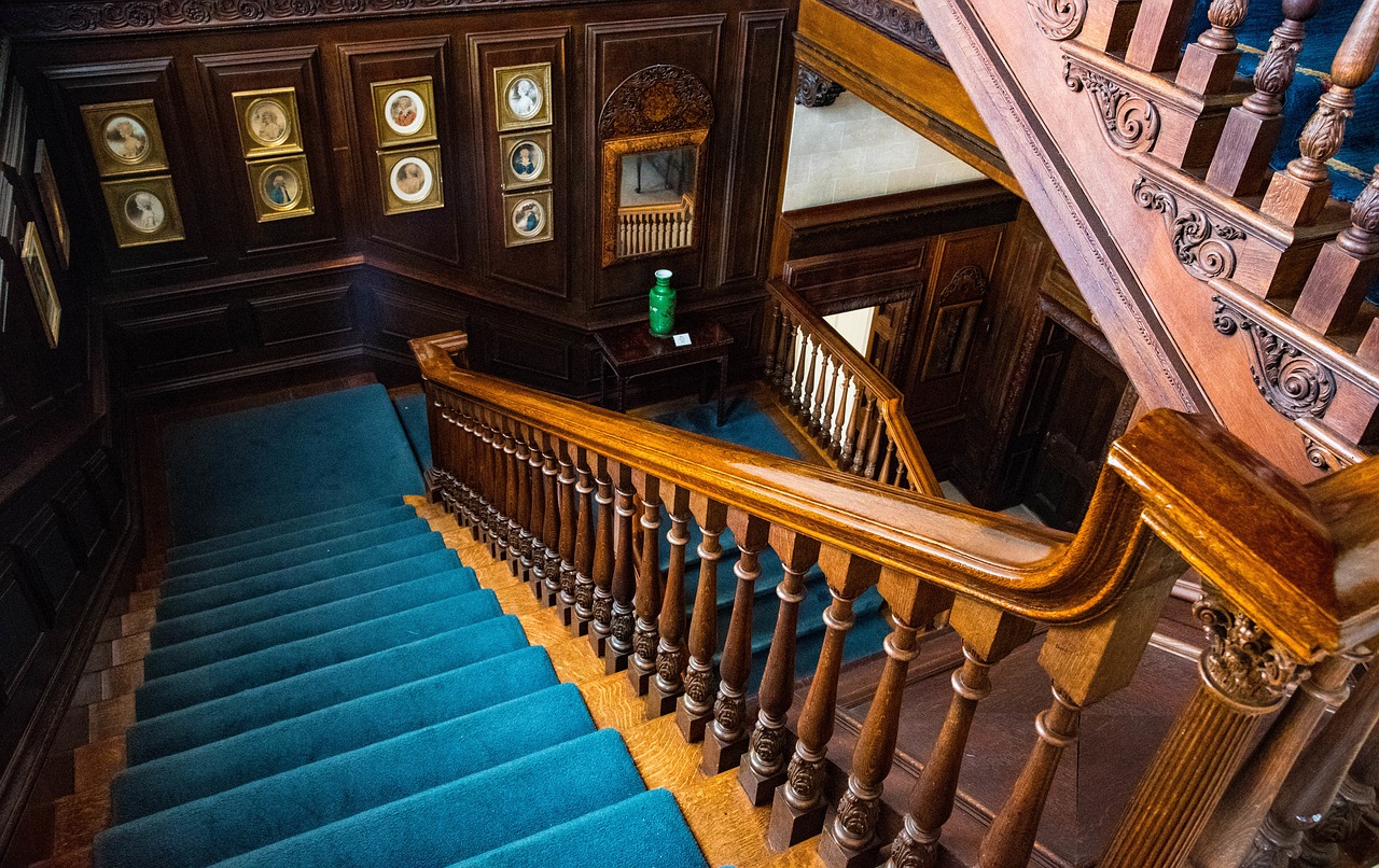 Stunning century home with a richly detailed wood staircase.