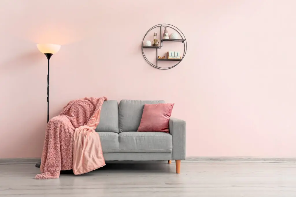 Soft Pink Walls and Grey Sofa