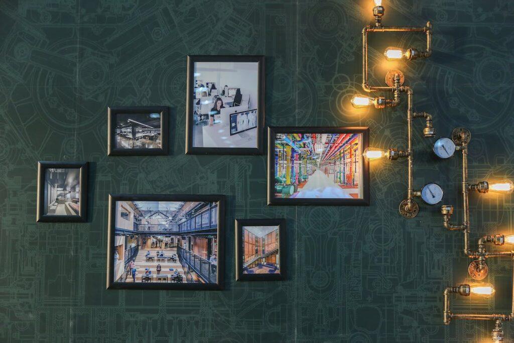Framed Prints on a Green Bathroom Wall