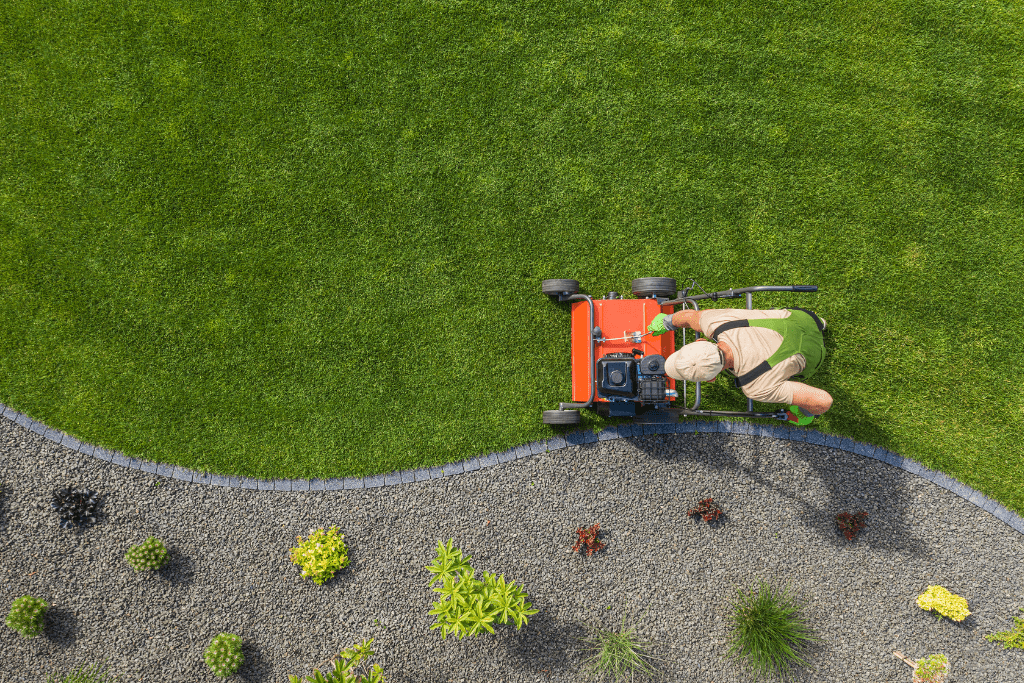 Lawn Aeration Machine Being Used to Aerate a Lush Green Lawn